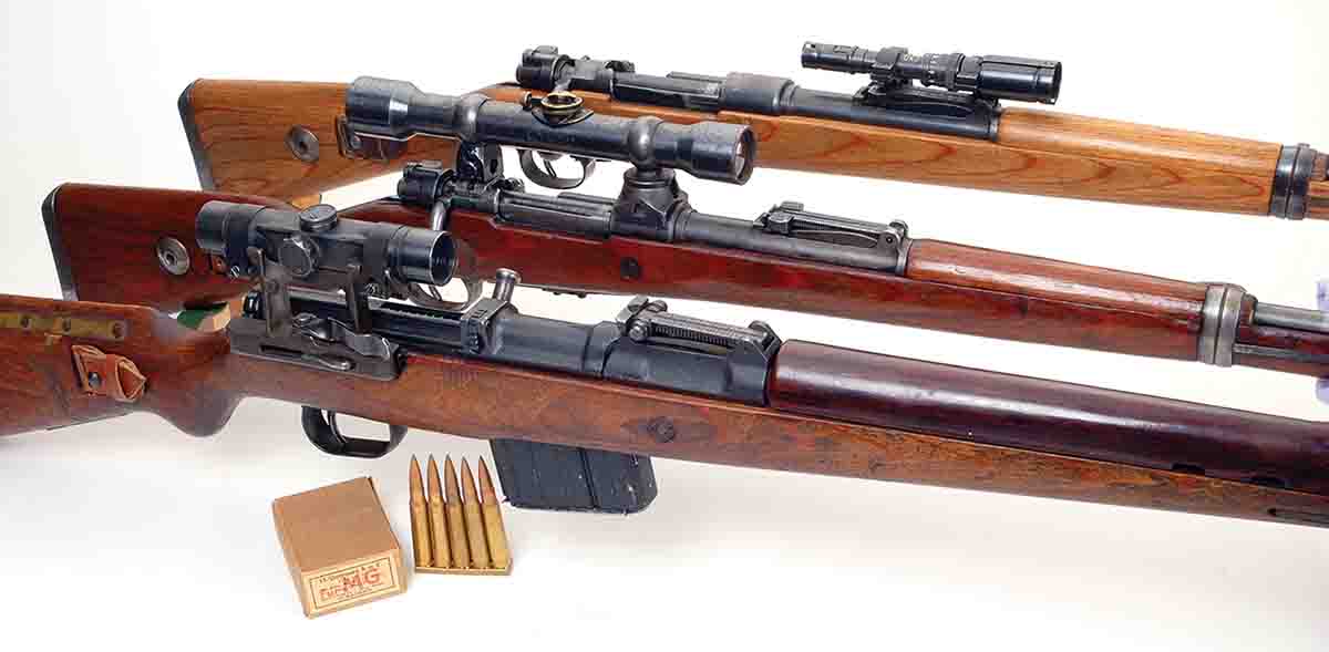 This photo shows a range of different mounting systems tried by the Germans in World War II. A K98k with 1.5x ZF41 scope (top) mounted alongside the open rear sight. A K98k with a ZF39 4x scope (middle) in low turret mounts. Note the “tunnel” in the rear mount, which allowed use of the rifle’s iron sights. The K43 (bottom) with a ZF4 4x scope in quick detachable rear side mount.